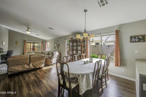 a view of a dining room with furniture window and wooden floor