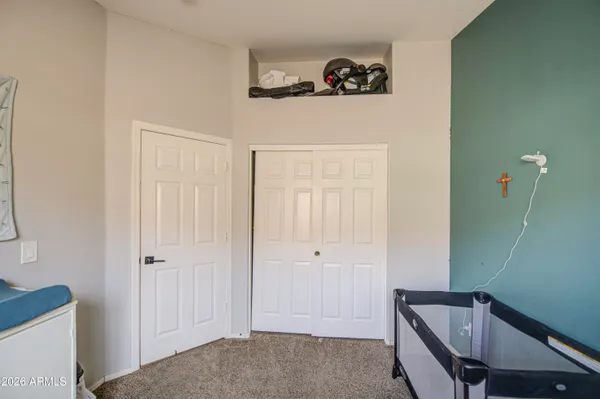 a bedroom with furniture and a window