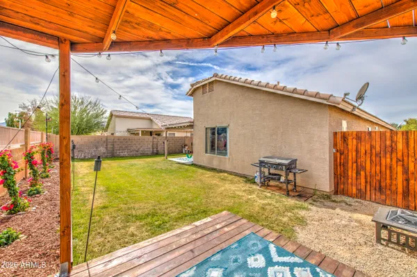 a view of a backyard with sitting area