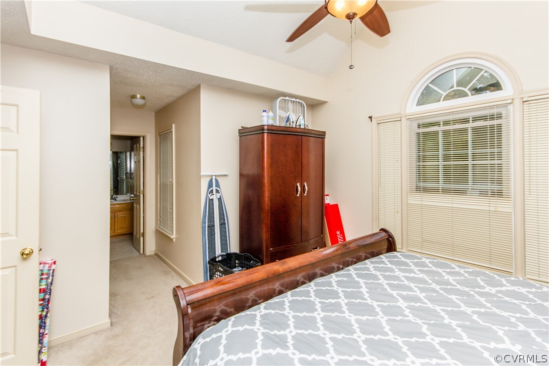 4004 Paces Ferry Road Chester, VA 23831 - Photo 30 of 50 a bedroom with a bed and a chandelier