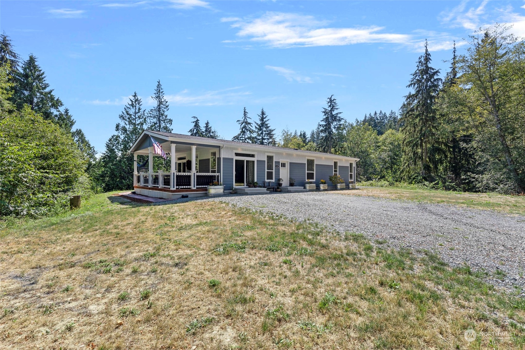 6303 Kirkhill Road Clinton, WA 98236 - Photo 1 of 40 a view of a house with a garden and trees