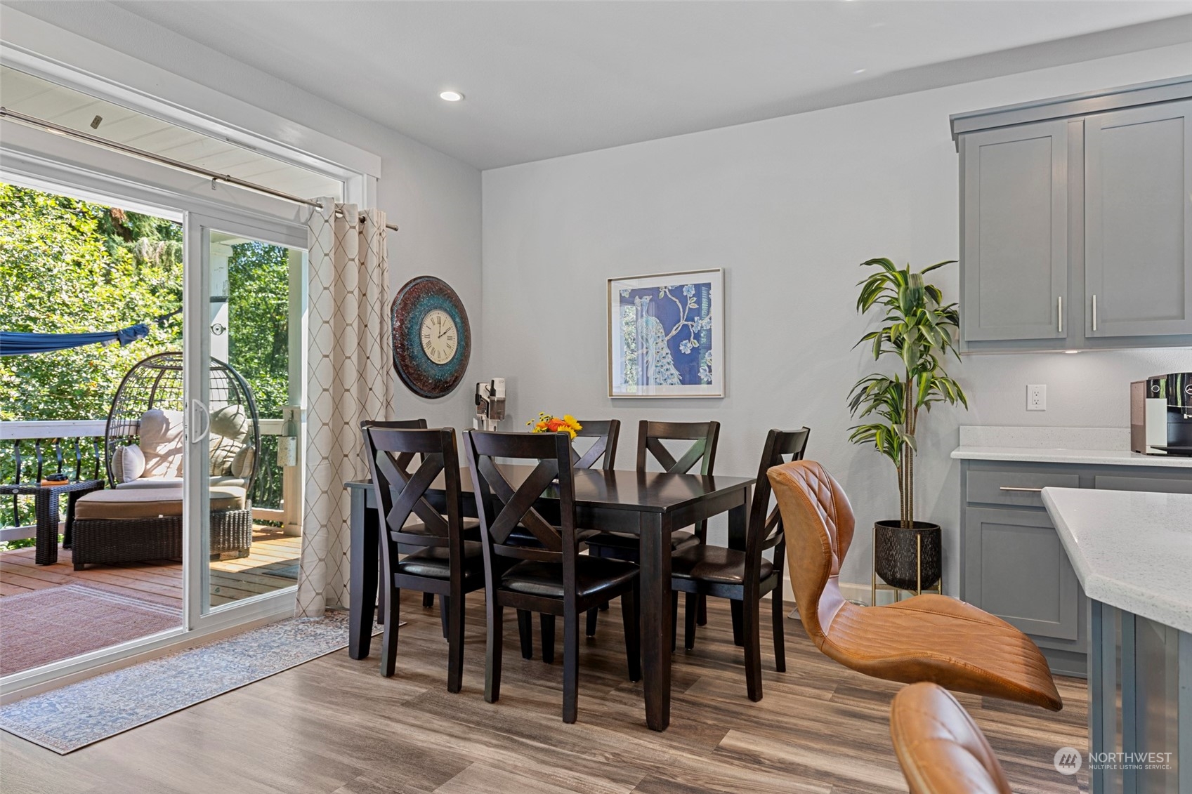 6303 Kirkhill Road Clinton, WA 98236 - Photo 11 of 40 a view of a dining room with furniture window and wooden floor