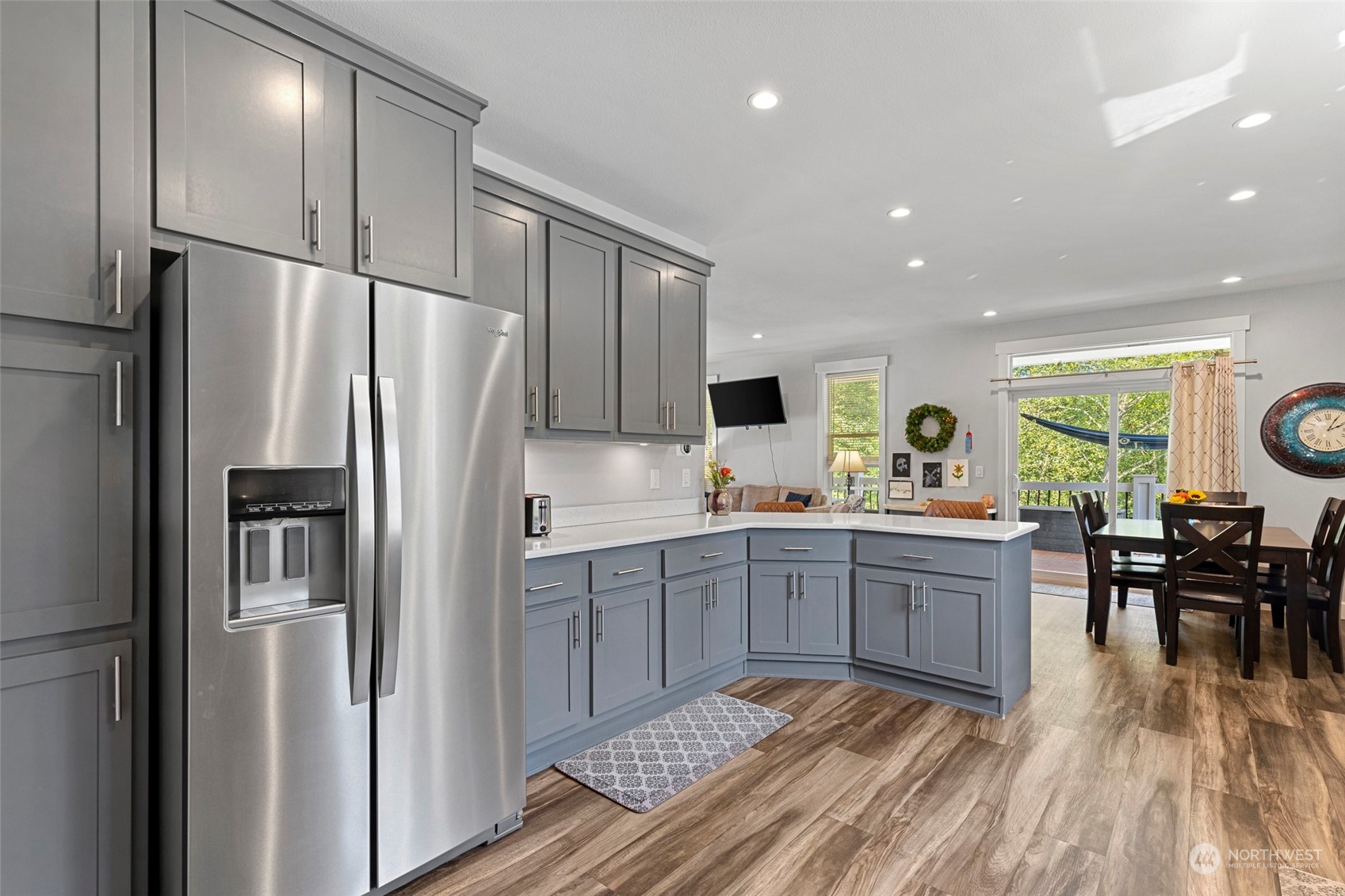6303 Kirkhill Road Clinton, WA 98236 - Photo 14 of 40 a kitchen with stainless steel appliances granite countertop a refrigerator and a stove top oven