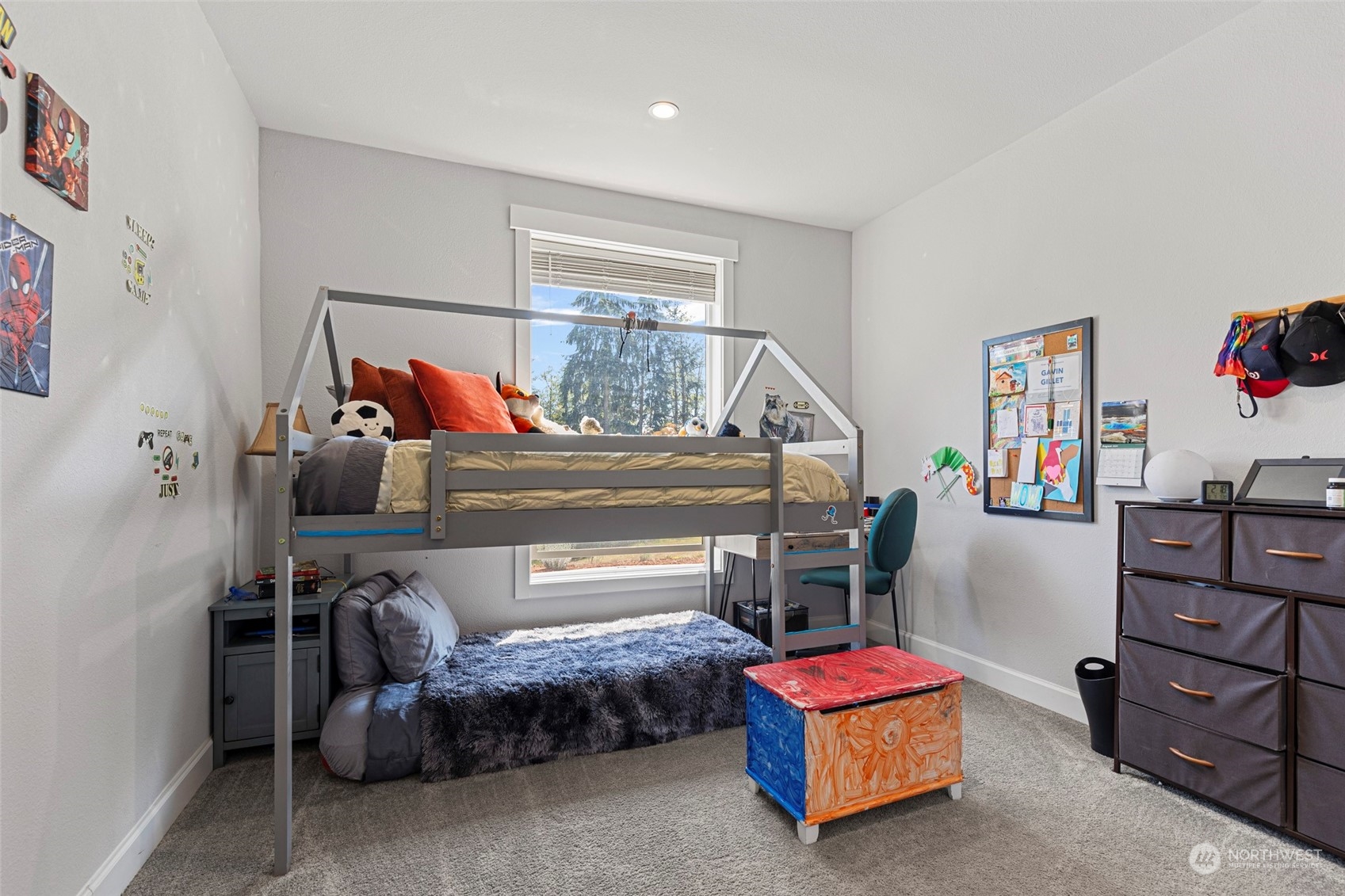 6303 Kirkhill Road Clinton, WA 98236 - Photo 24 of 40 a bedroom with a bed and a dresser in it