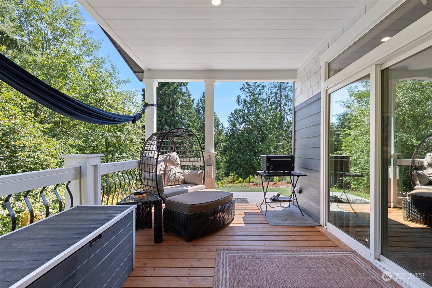6303 Kirkhill Road Clinton, WA 98236 - Photo 30 of 40 a view of a patio with lawn chairs and wooden floor