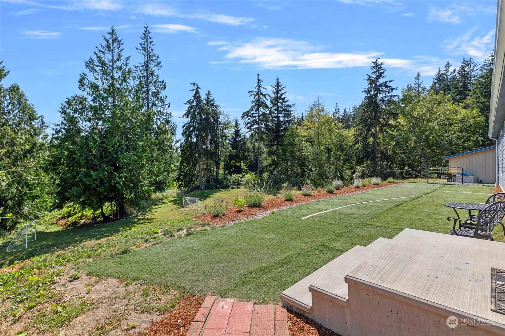 6303 Kirkhill Road Clinton, WA 98236 - Photo 32 of 40 a view of a garden and basketball court