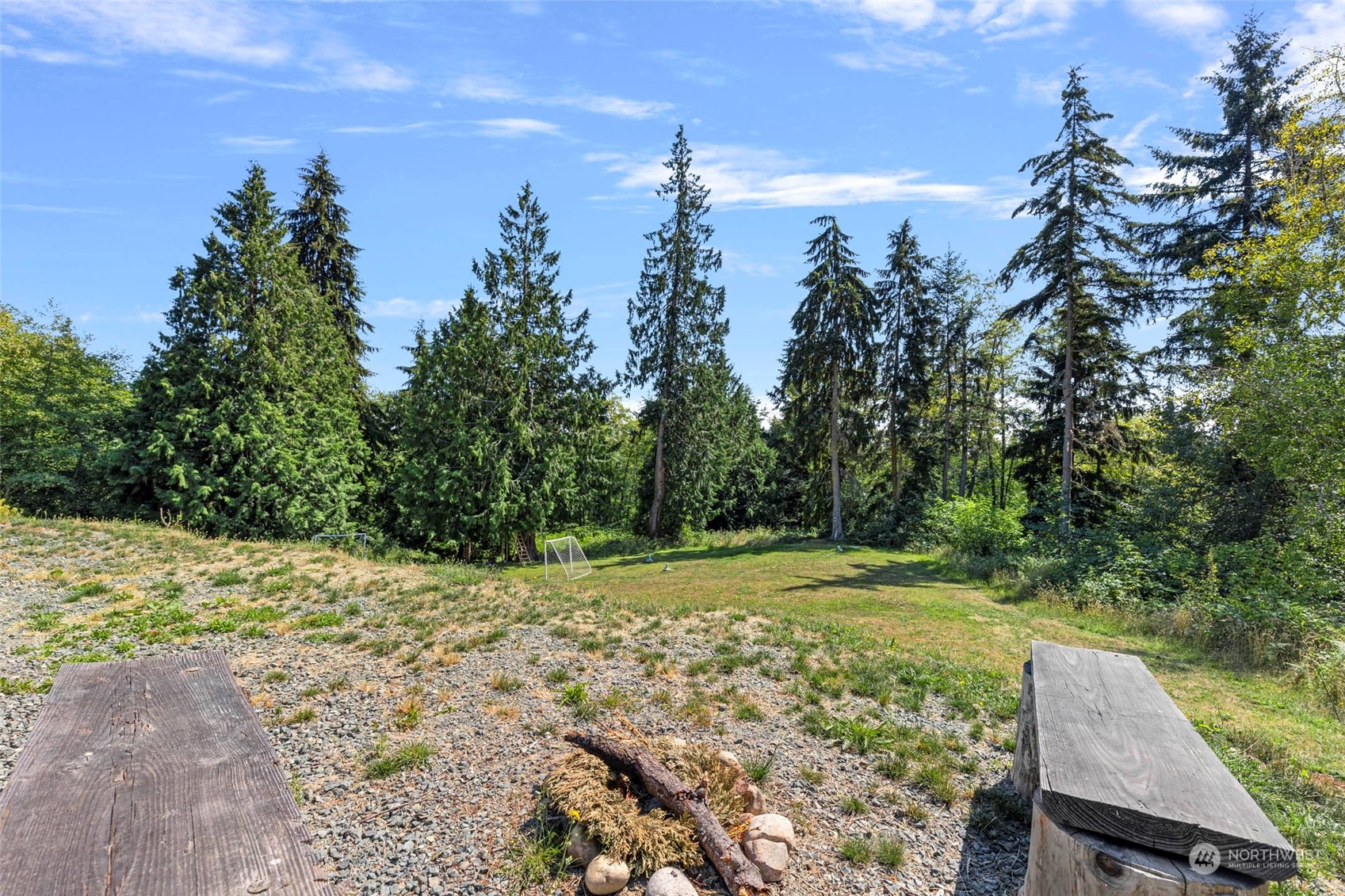6303 Kirkhill Road Clinton, WA 98236 - Photo 36 of 40 a view of a yard with a tree