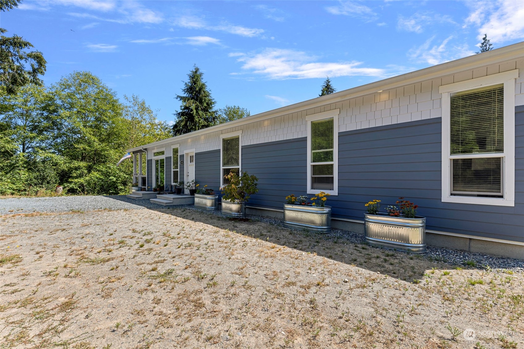 6303 Kirkhill Road Clinton, WA 98236 - Photo 37 of 40 a front view of a house with patio