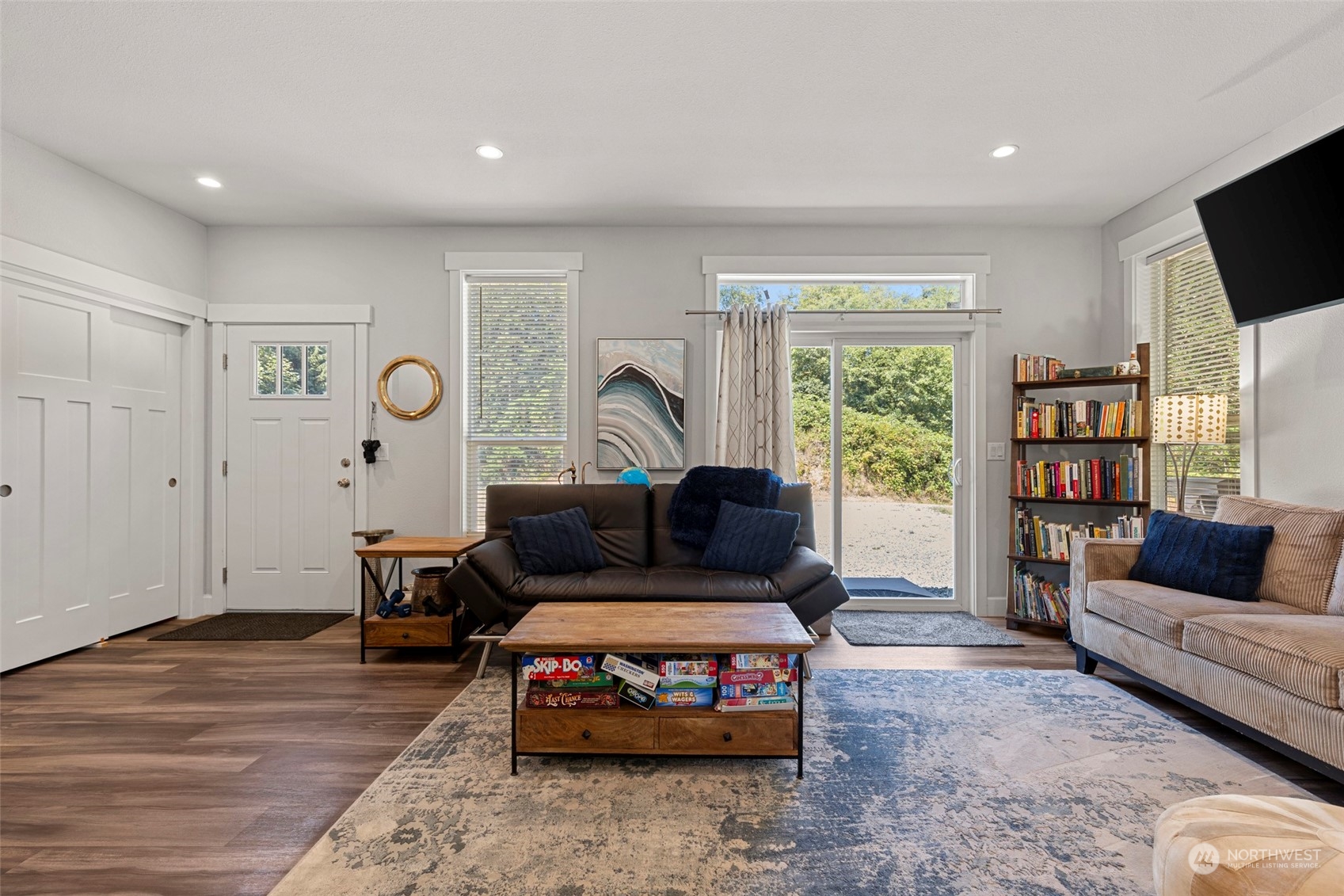 6303 Kirkhill Road Clinton, WA 98236 - Photo 10 of 40 a living room with furniture and a flat screen tv