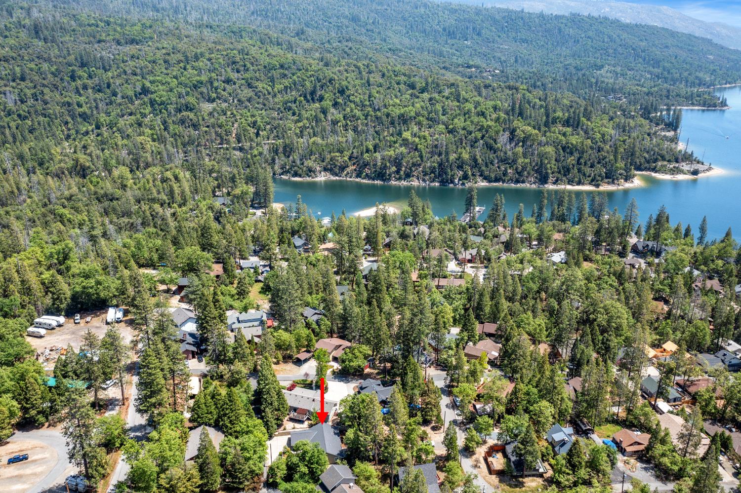 39398 Robin Bass Lake, CA 93604 - Photo 28 of 31 a view of a lake with a house in the background