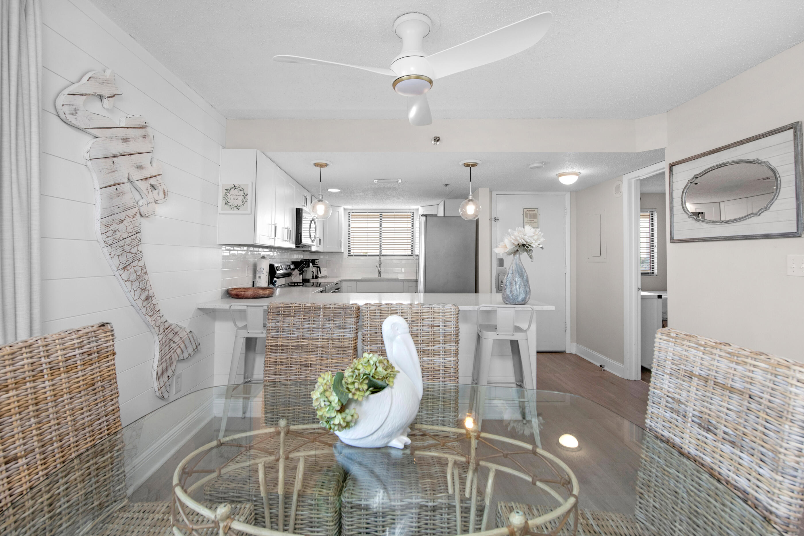 1040 Highway 98, Unit 518 Destin, FL 32541 - Photo 13 of 40 a dining room with furniture and a chandelier