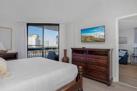 a bedroom with a bed and a dresser