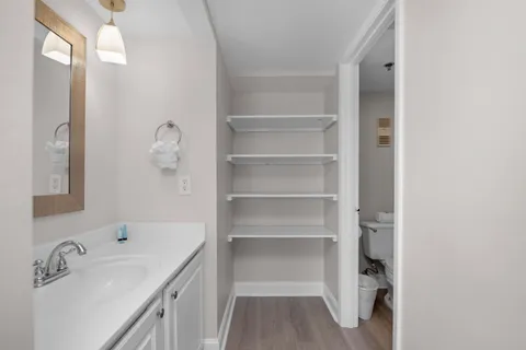 a bathroom with a sink a mirror and shower