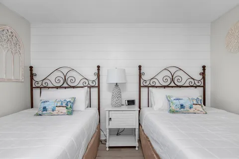 a bedroom with a bed and a table