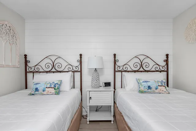 a bedroom with a bed and a table