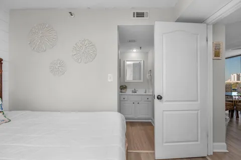 a large white bed in a white room