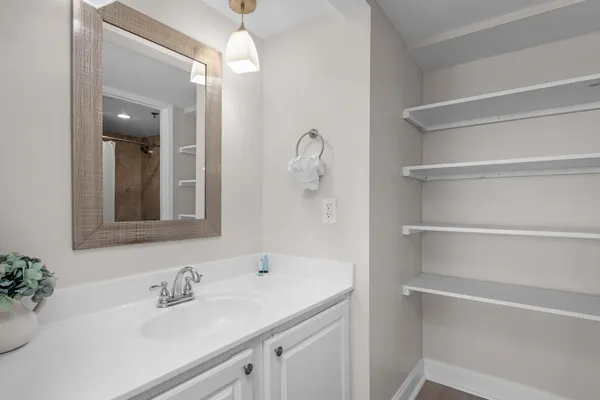 a bathroom with a sink and a mirror