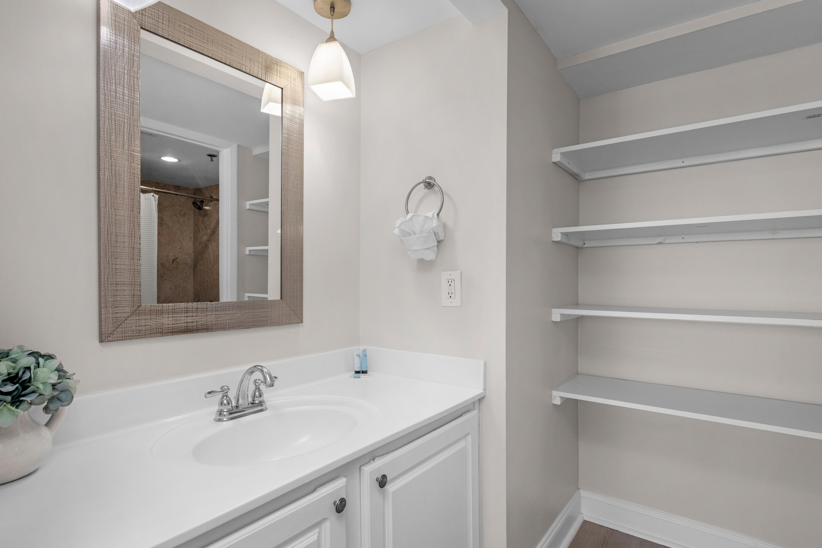 1040 Highway 98, Unit 518 Destin, FL 32541 - Photo 26 of 40 a bathroom with a sink and a mirror