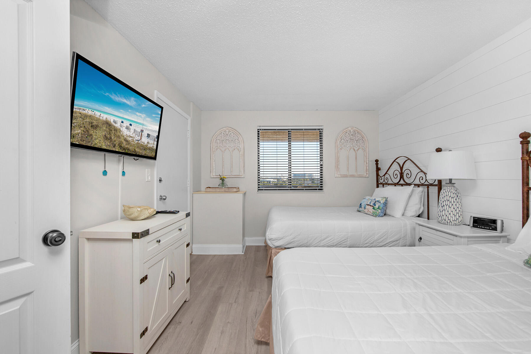 1040 Highway 98, Unit 518 Destin, FL 32541 - Photo 28 of 40 a bedroom with a bed and a flat screen tv