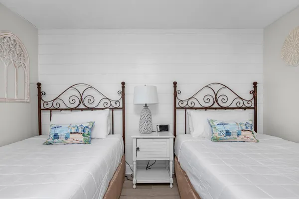 a bedroom with a bed and a table