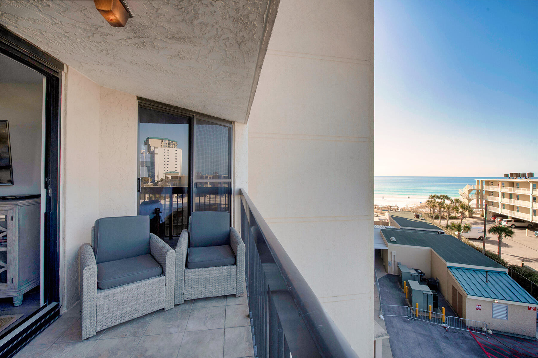 1040 Highway 98, Unit 518 Destin, FL 32541 - Photo 3 of 40 a balcony with furniture and a potted plant