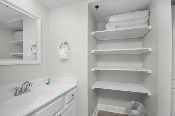 a bathroom with a sink and a mirror