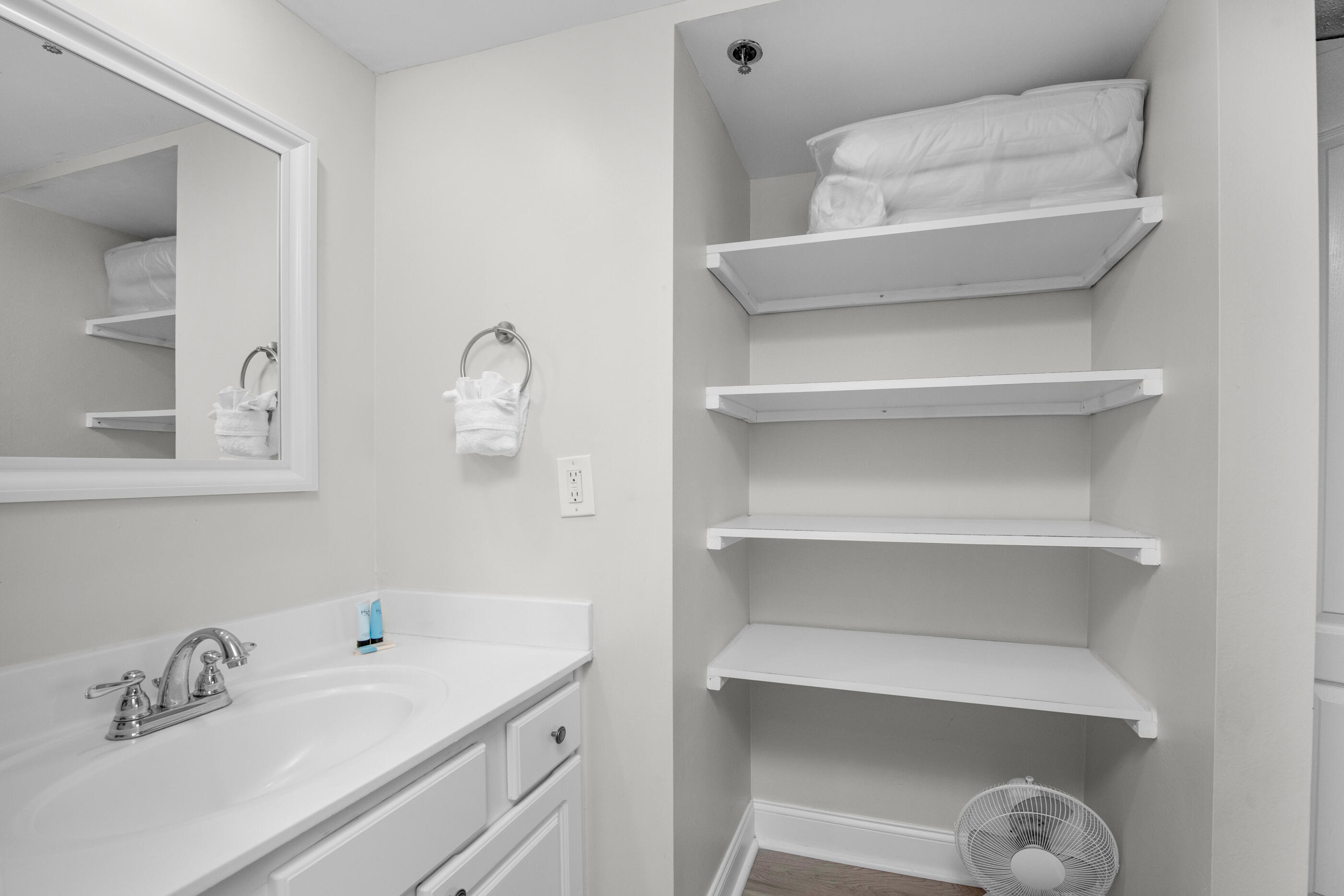 1040 Highway 98, Unit 518 Destin, FL 32541 - Photo 32 of 40 a bathroom with a sink and a mirror