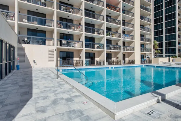 a view of swimming pool with a balcony