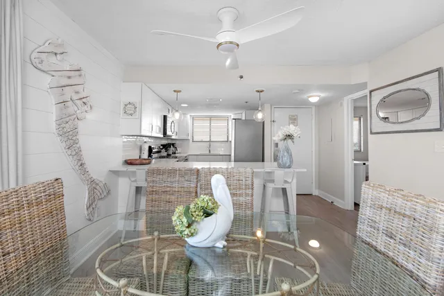 a dining room with furniture and a chandelier
