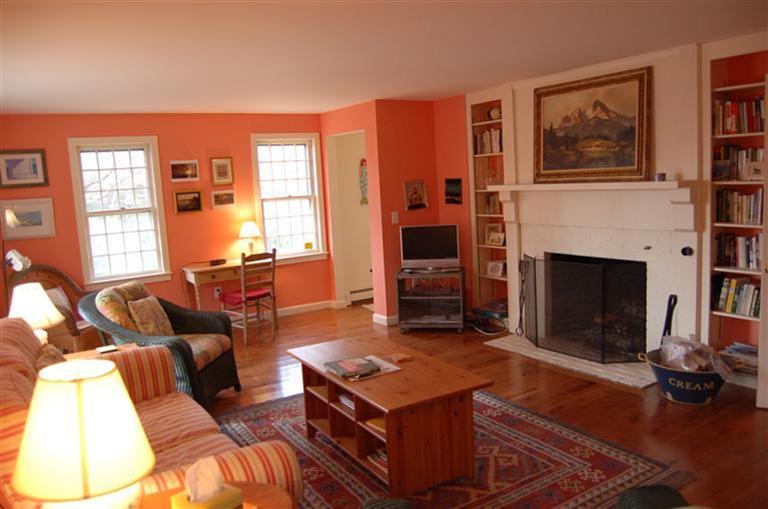 31 Truro Center Road Truro, MA 02666 - Photo 3 of 15 a living room with furniture and a fireplace