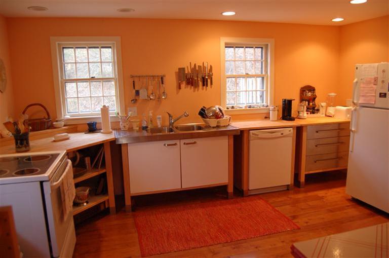 31 Truro Center Road Truro, MA 02666 - Photo 8 of 15 a room with a sink wooden cabinets and a window
