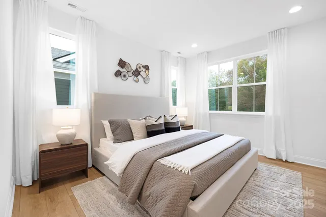 a bathroom with double sink and a mirror