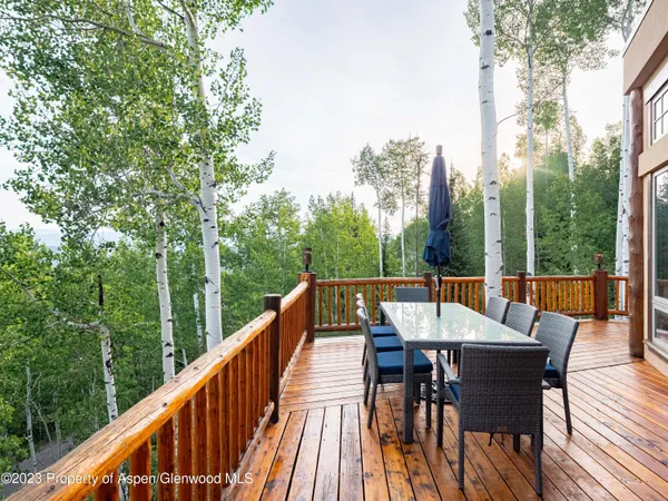 a view of a patio with a table chairs and a table