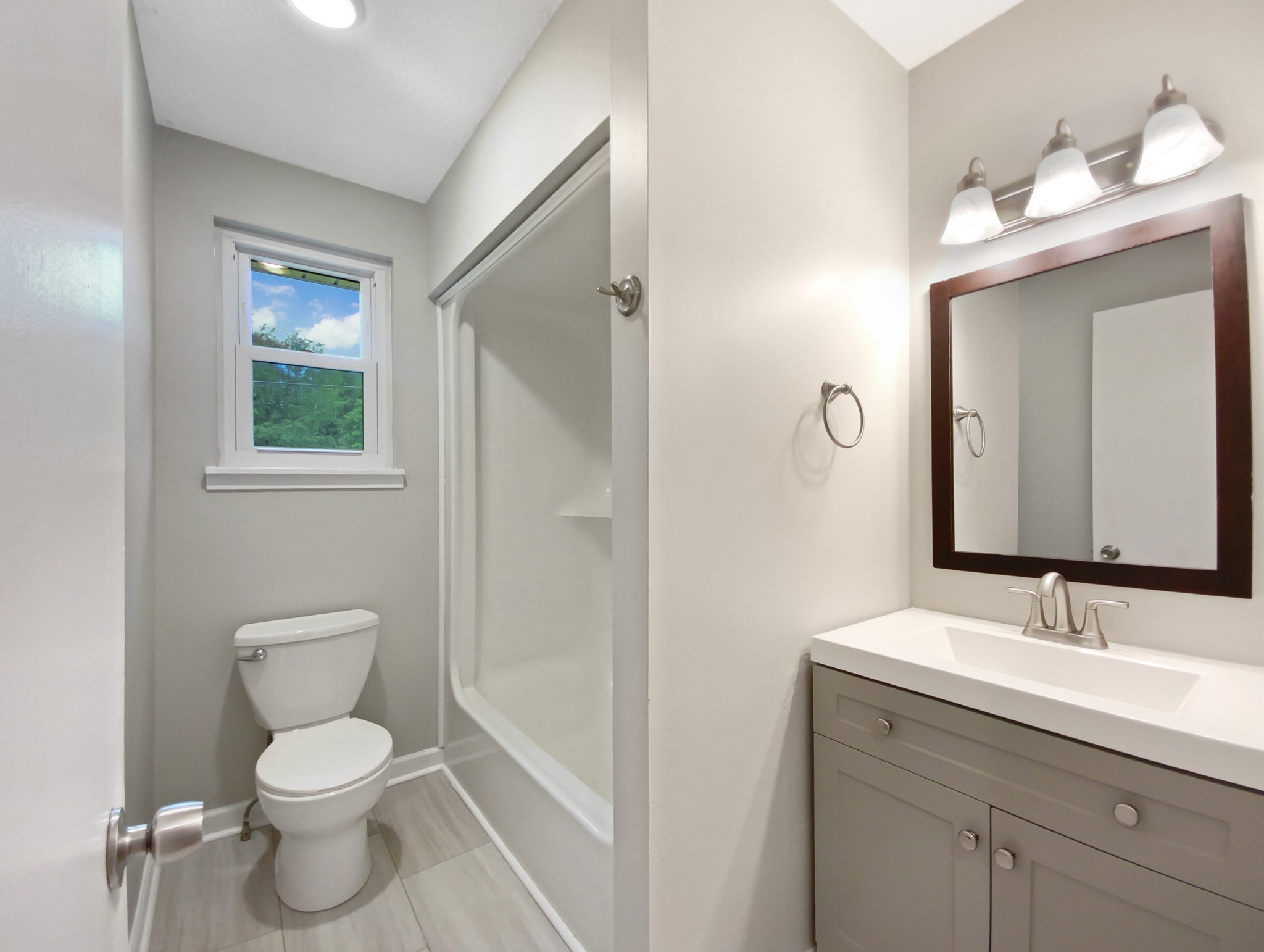 1223 Main Street Pleasant View, TN 37146 - Photo 18 of 20 a bathroom with a toilet sink and mirror