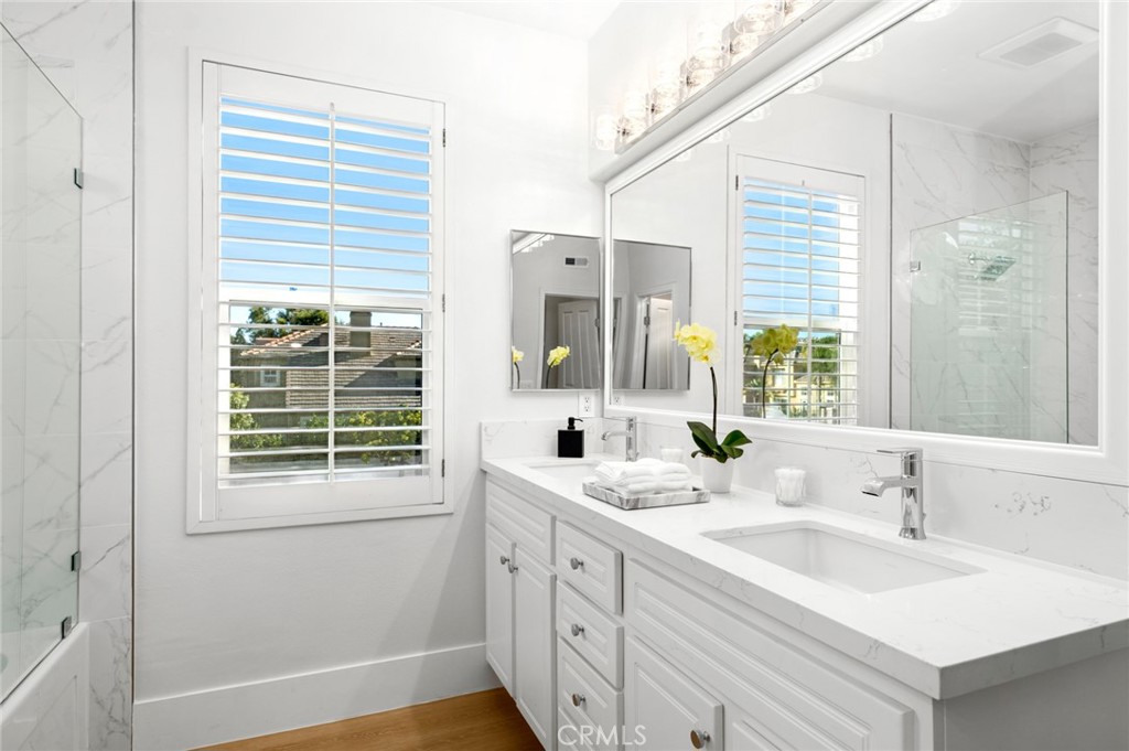 20 Fecamp Newport Coast, CA 92657 - Photo 16 of 35 a bathroom with a double vanity sink and a window