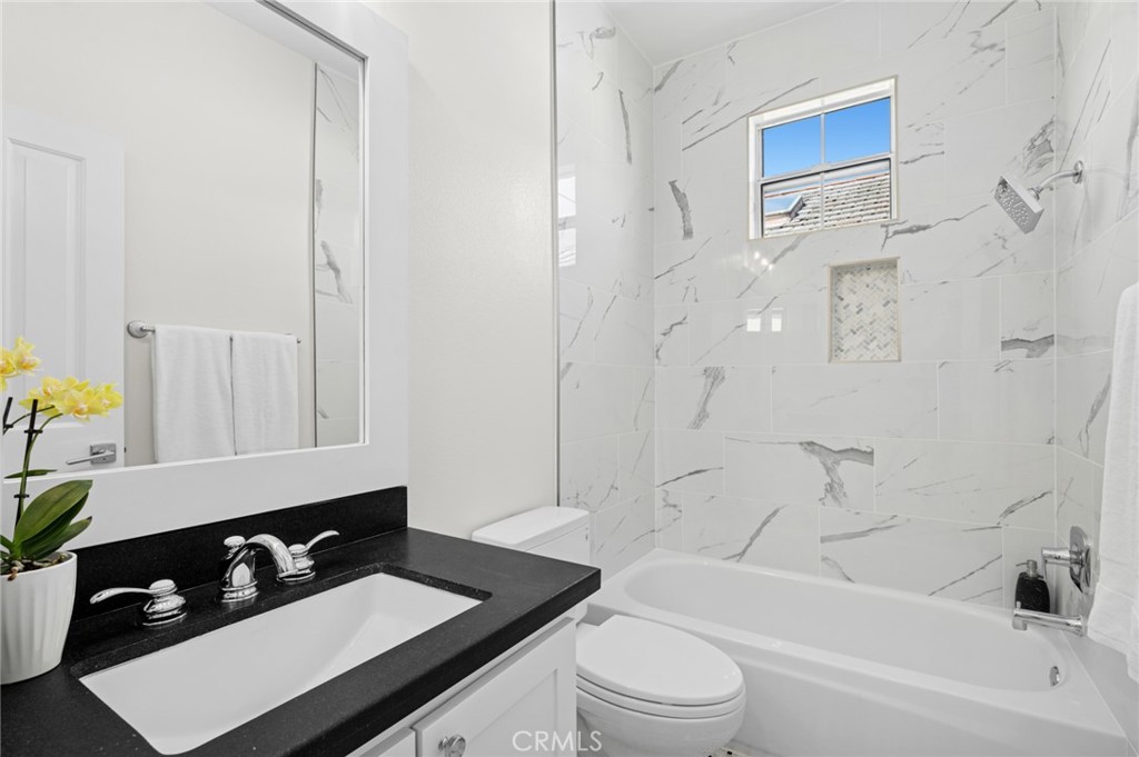 20 Fecamp Newport Coast, CA 92657 - Photo 22 of 35 a bathroom with a bathtub a sink a toilet and a shower