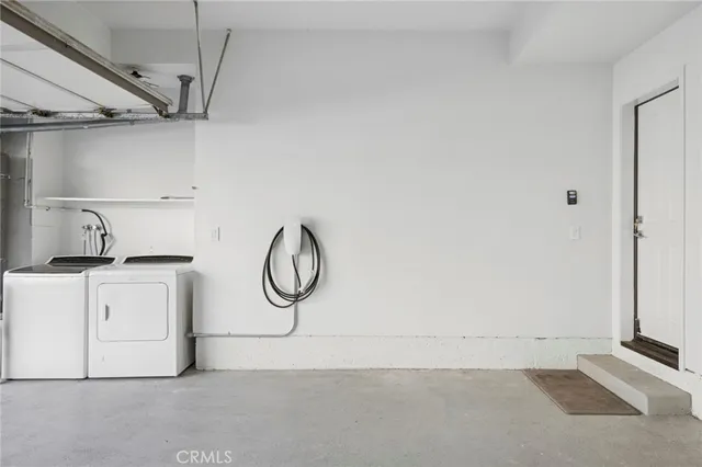 a view of a storage & utility room with washer and dryer