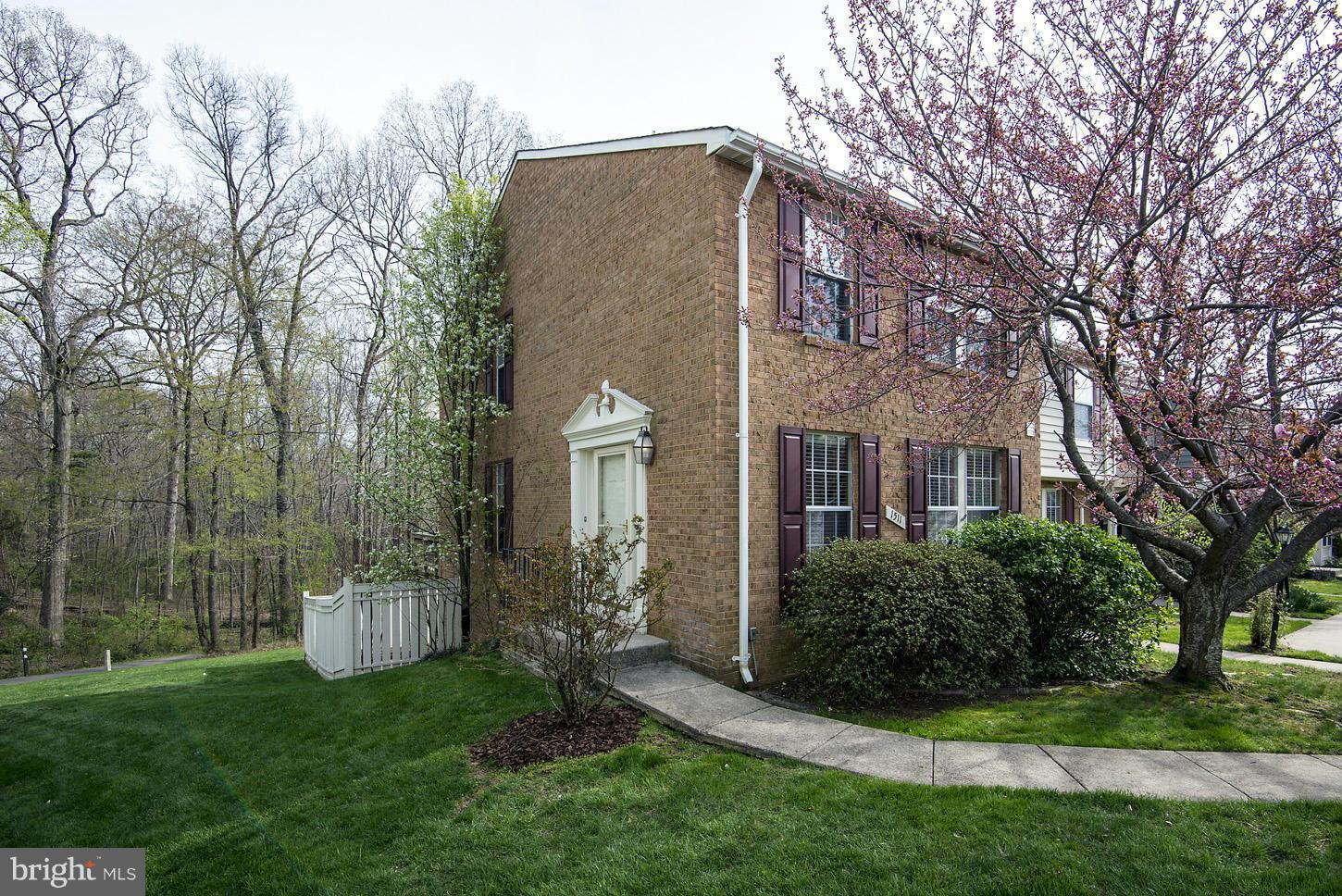 1511 Autumn Ridge Circle Reston, VA 20194 - Photo 1 of 29 a front view of a house with a garden