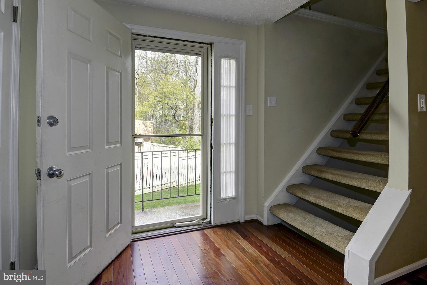 1511 Autumn Ridge Circle Reston, VA 20194 - Photo 2 of 29 a view of a room with wooden floor and windows