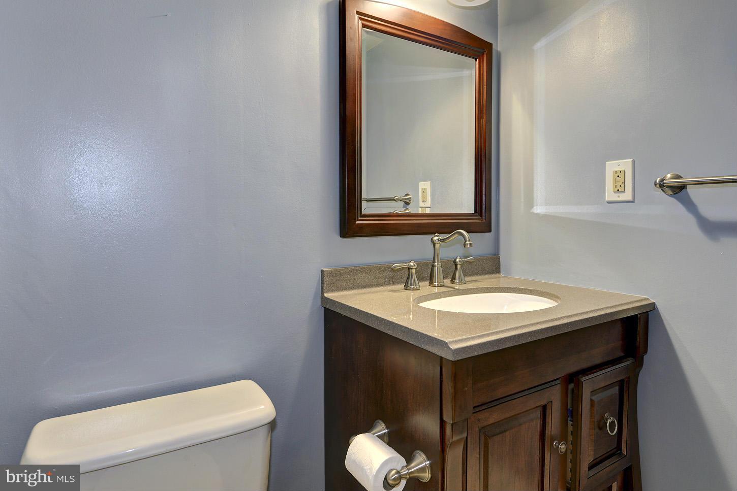 1511 Autumn Ridge Circle Reston, VA 20194 - Photo 21 of 29 a bathroom with a toilet sink and mirror
