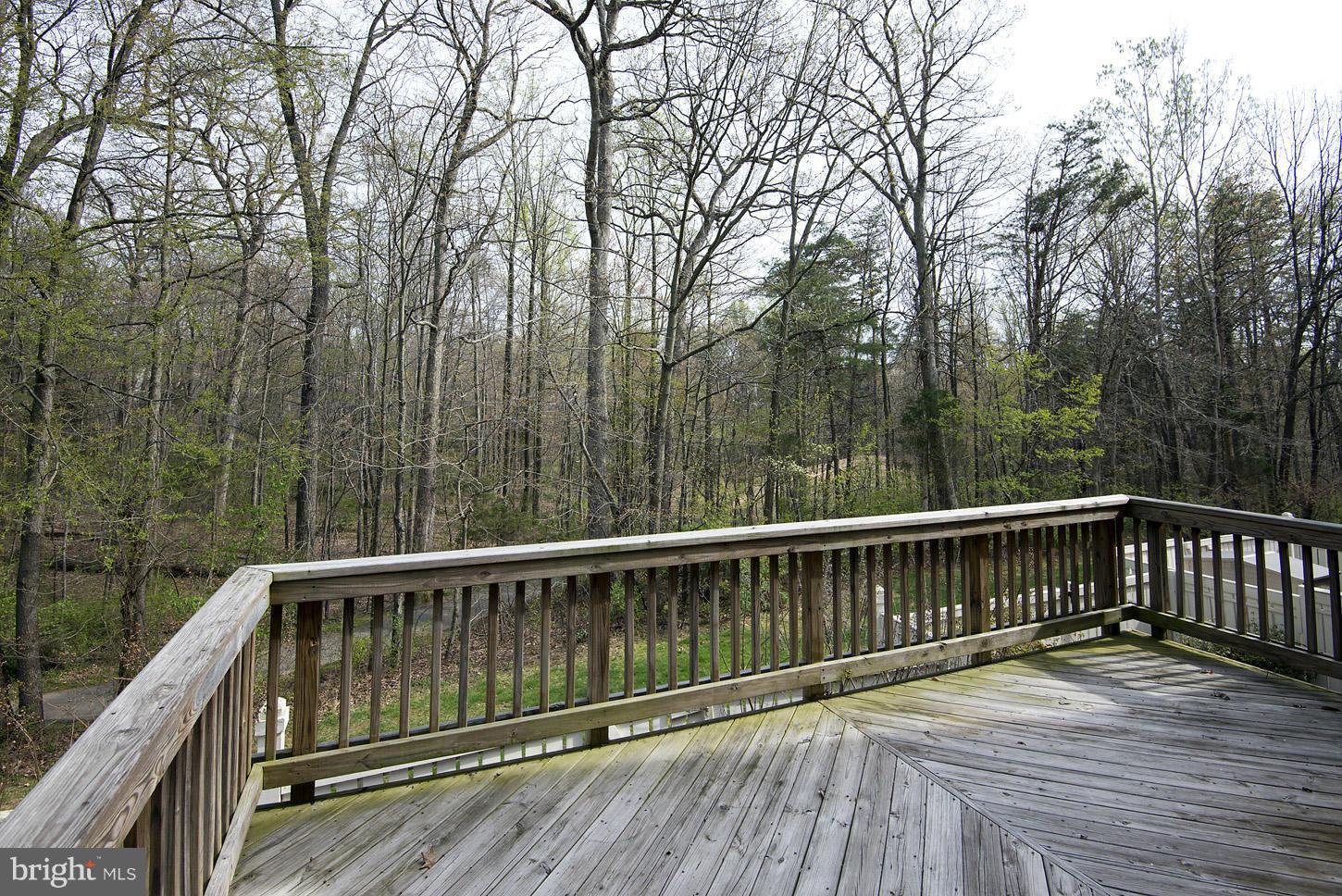 1511 Autumn Ridge Circle Reston, VA 20194 - Photo 22 of 29 a view of balcony with wooden floor and fence