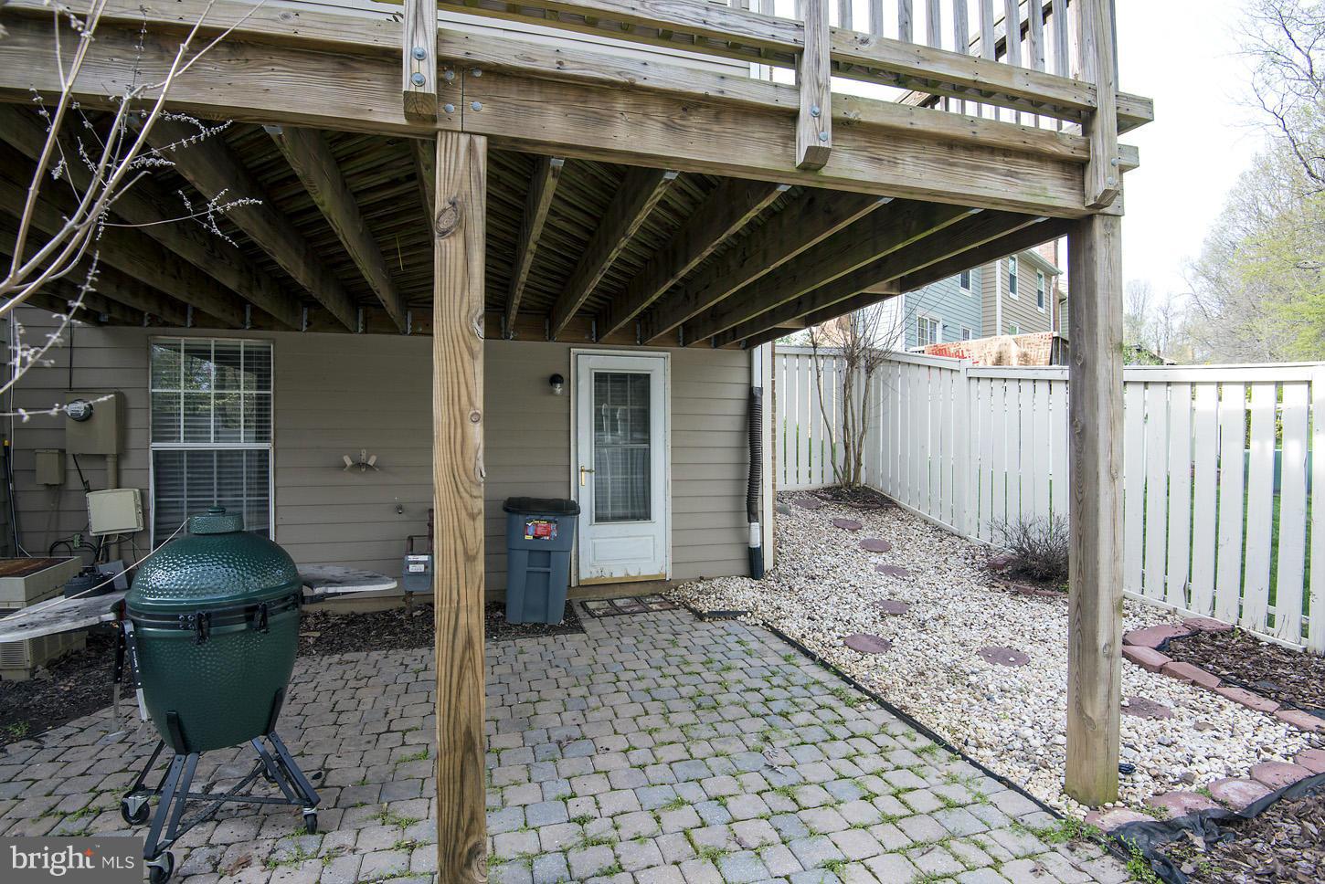 1511 Autumn Ridge Circle Reston, VA 20194 - Photo 24 of 29 a backyard of a house with table and chairs