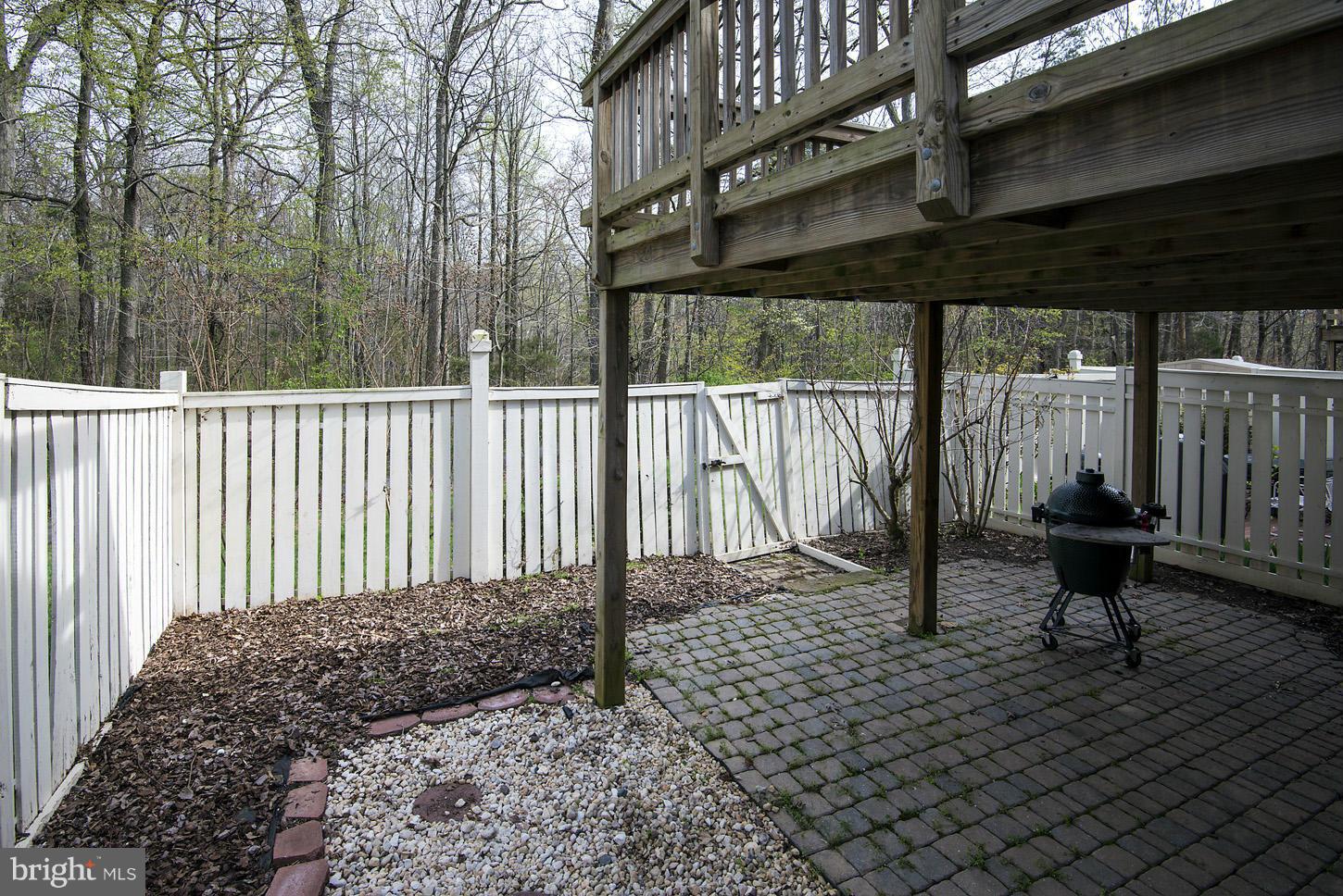 1511 Autumn Ridge Circle Reston, VA 20194 - Photo 25 of 29 a backyard of a house with table and chairs