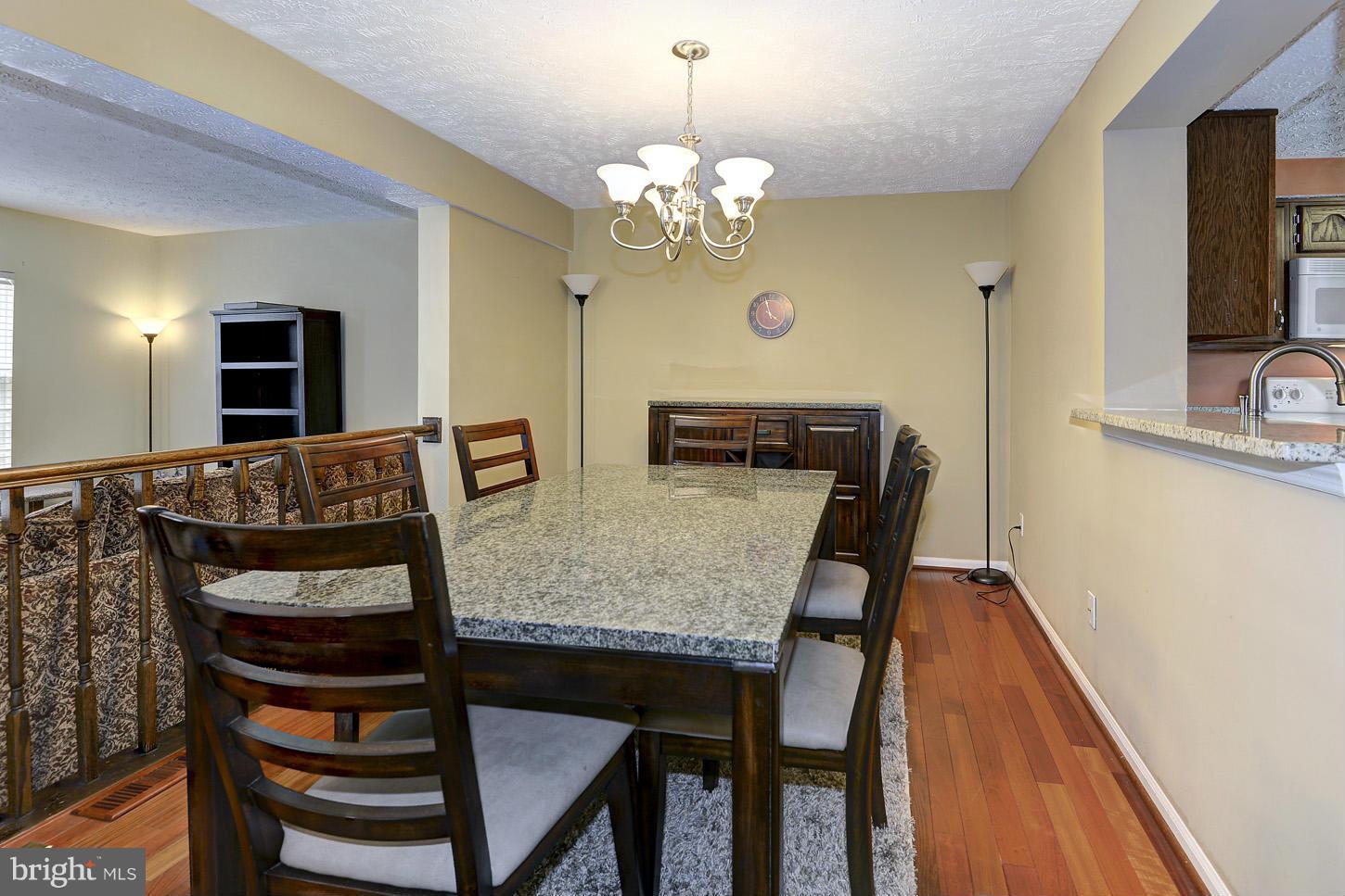 1511 Autumn Ridge Circle Reston, VA 20194 - Photo 6 of 29 a view of a dining room with furniture and wooden floor