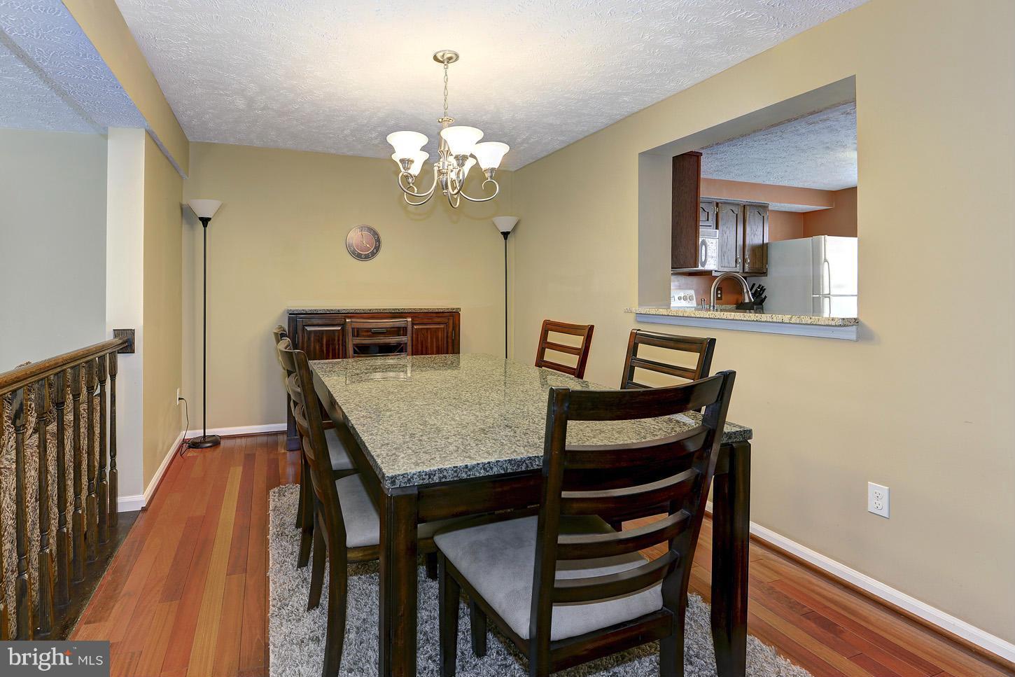 1511 Autumn Ridge Circle Reston, VA 20194 - Photo 7 of 29 a view of a dining room with furniture and wooden floor