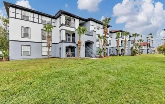 a view of multiple house with a yard