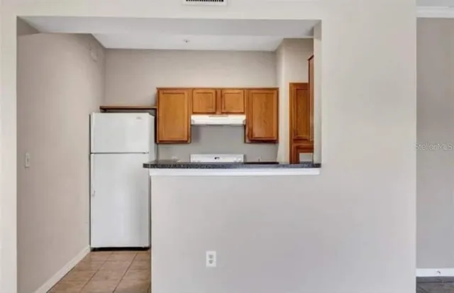 a close view of a refrigerator in kitchen