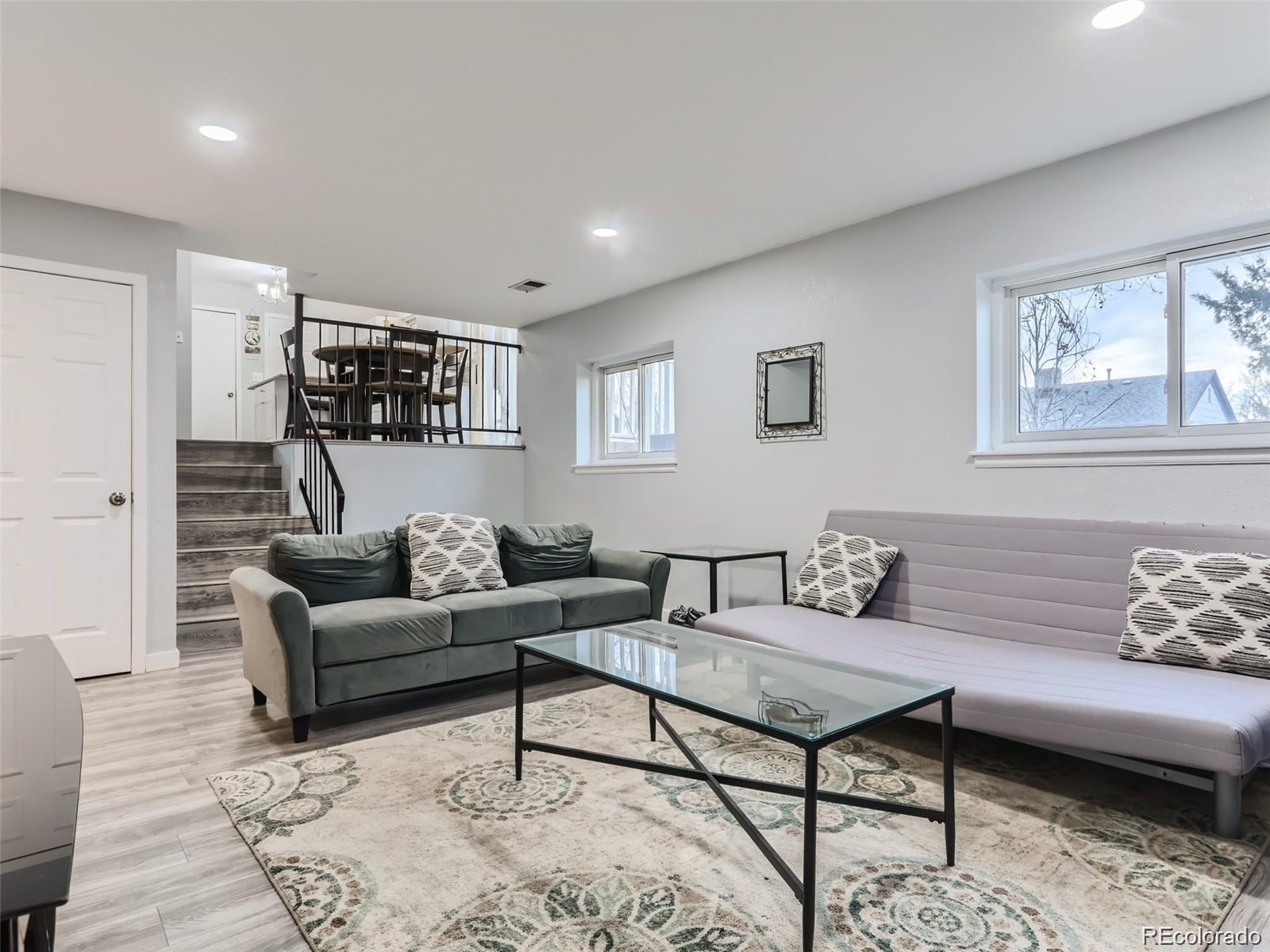 5941 South Perth Street Centennial, CO 80015 - Photo 14 of 28 a living room with furniture and a rug