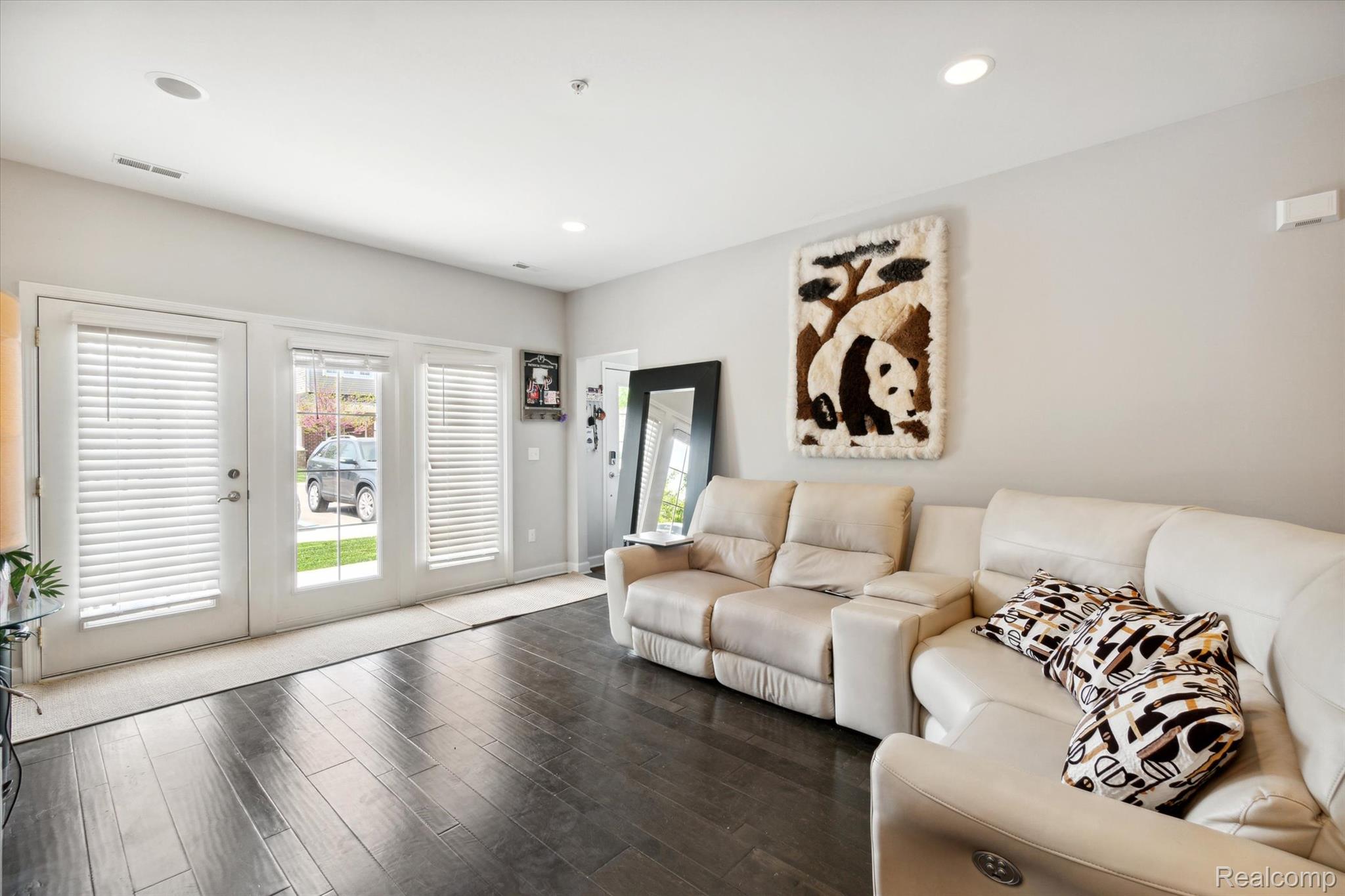 5662 Arbor Chase Drive Ann Arbor, MI 48103 - Photo 5 of 27 Living area featuring dark wood-finish flooring, recessed ceiling lighting, and light gray walls