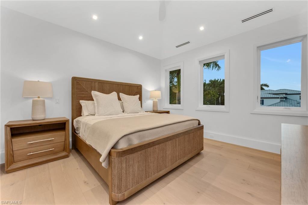 1935 5th Street South Naples, FL 34102 - Photo 29 of 40 a bedroom with a bed and window